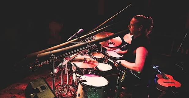 Live music at camp — drummer mid-set