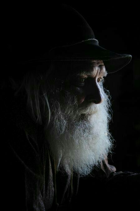 An elder in low light