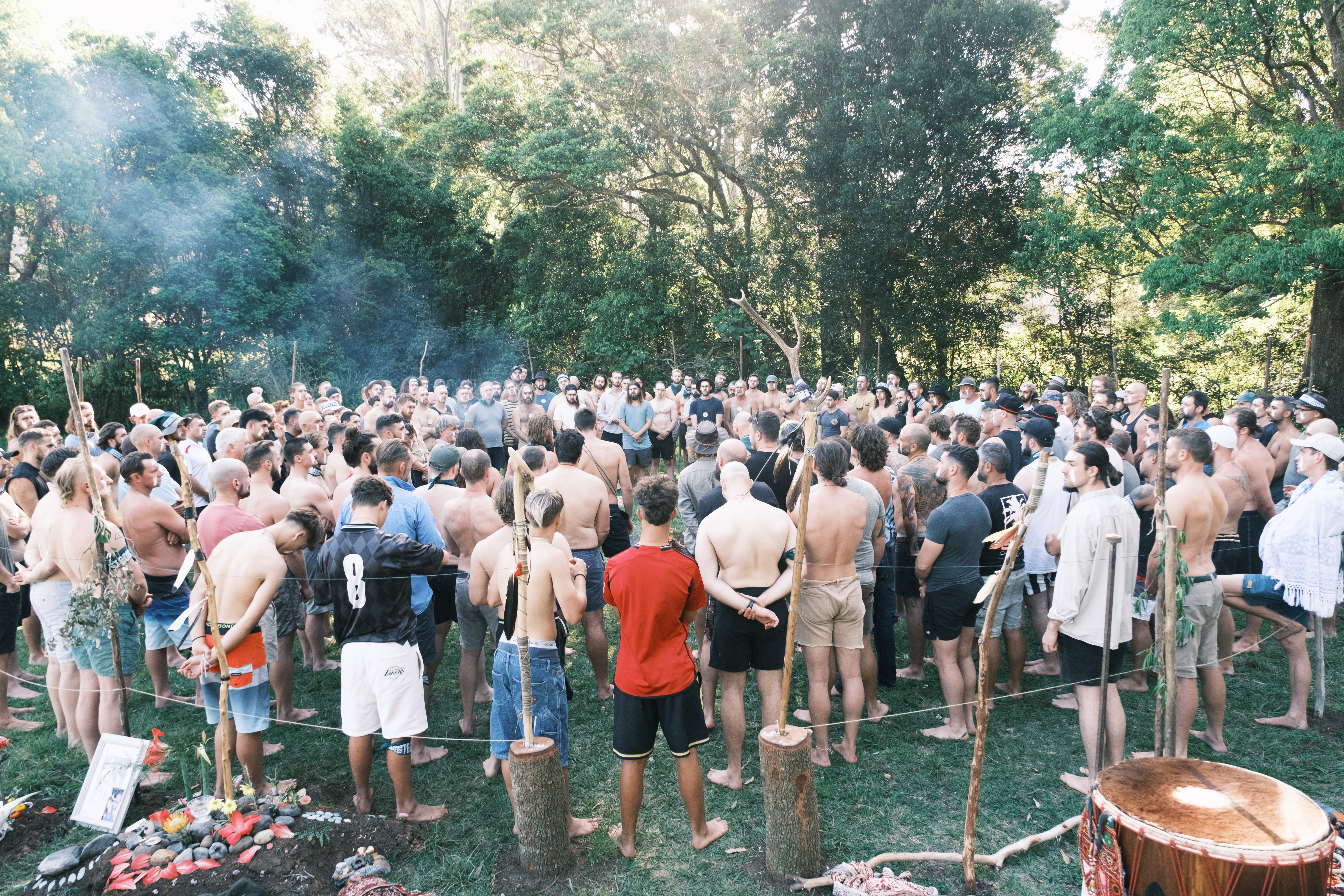 The whole gathering standing in circle around the altar