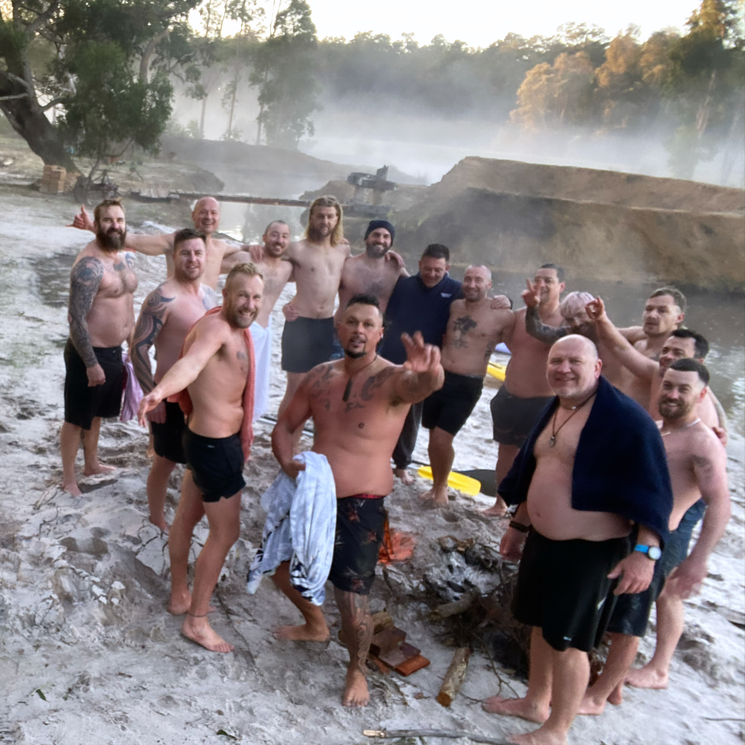 Men together at the river after a cold morning swim
